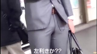 Man in Suit Enjoying Intimate Moments with Handsome Asian Guy