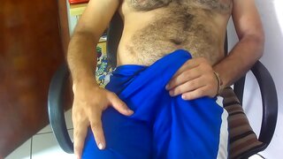 Guy Next Door Rubs Cock in Blue Shorts for Sensual Pleasure