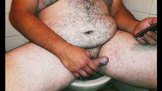 Macho Bear Masturbates While WatchingPorn OnHisCellPhone