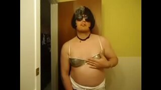 Nikki Smokes Seductively in Shiny Silver Bra for Hot CD Fetish Action